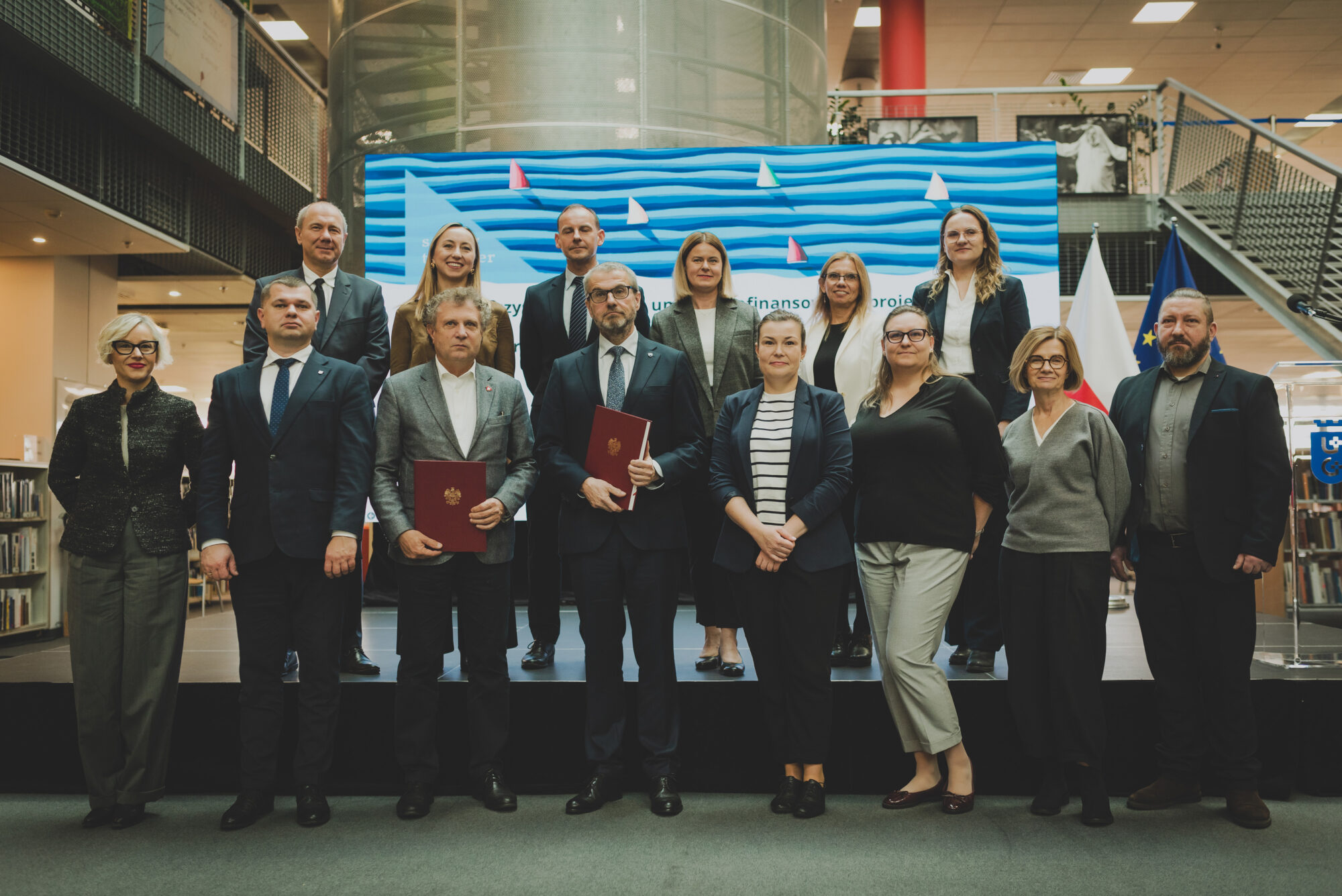 Group photo taken during the official signing of the AIMused project subsidy contract at the University of Gdańsk.